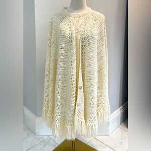 Vintage handmade women’s loose knit cape with buttons and hand openings EUC
